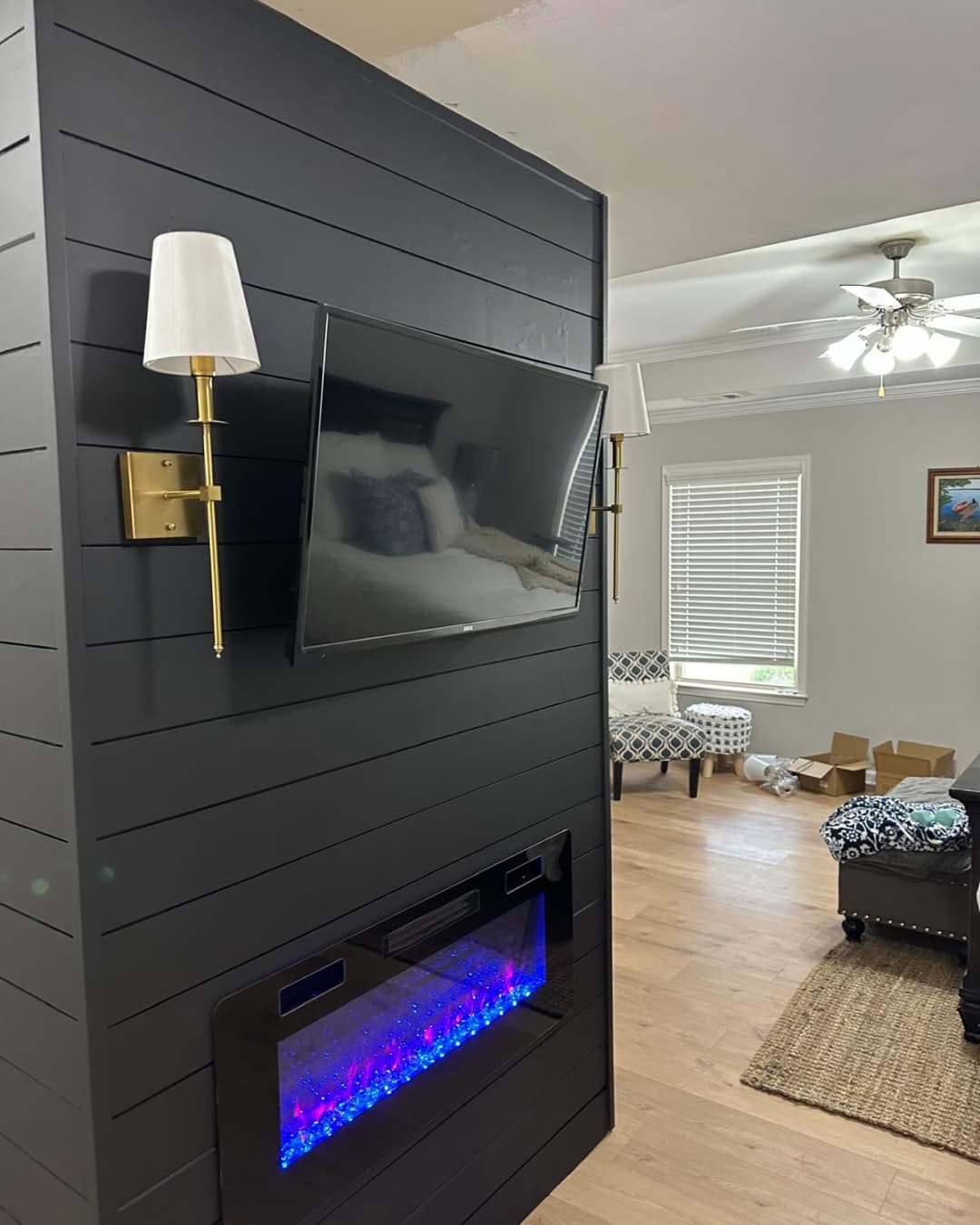 Shiplap fireplace feature wall with mounted television